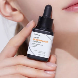 Skin TOGO Isntree Hyper Niacinamide 20 Serum bottle held in hand, featuring a dropper cap and white label.