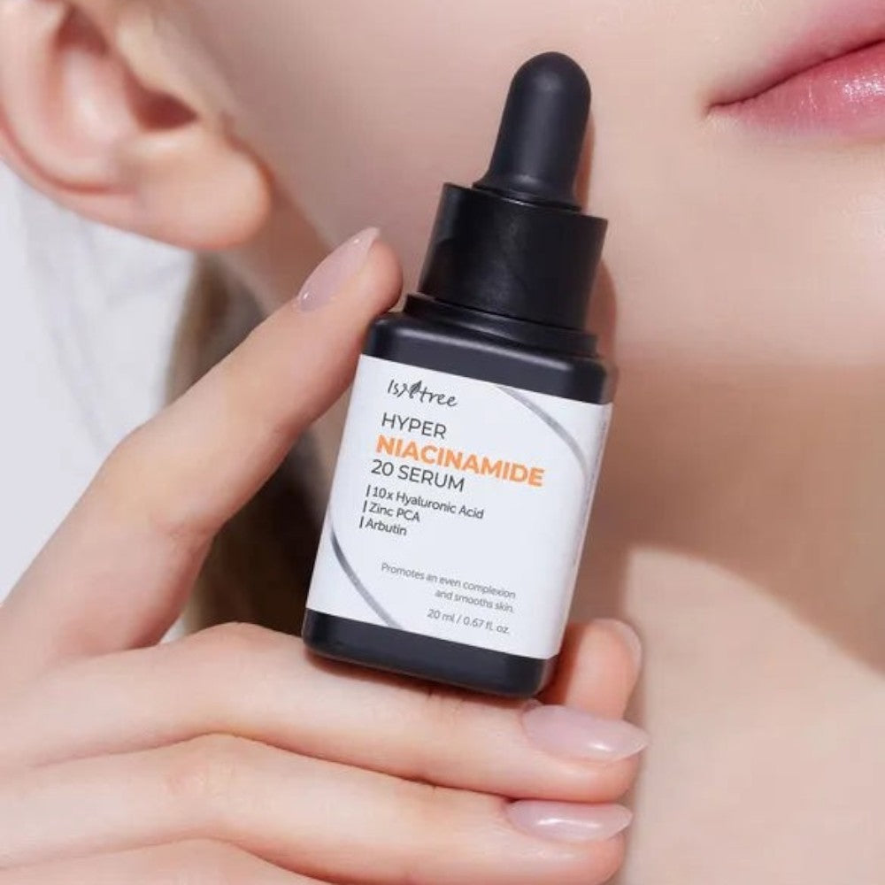 Skin TOGO Isntree Hyper Niacinamide 20 Serum bottle held in hand, featuring a dropper cap and white label.