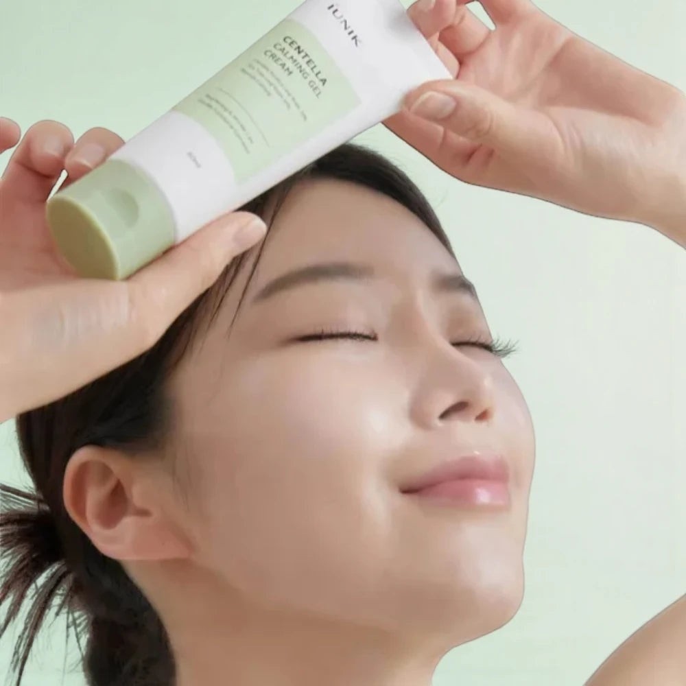 Skin TOGO model applying iUNIK Centella Calming Gel to her face for soothing and cooling skin care benefits.