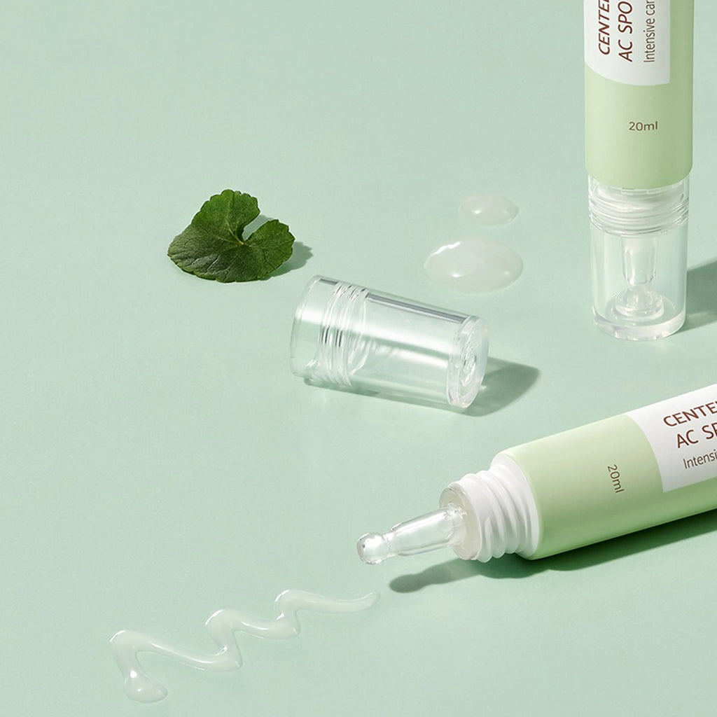 Skin TOGO iUNIK Centella Calming AC Spot Cream tubes with clear applicator tips and soothing gel texture on green