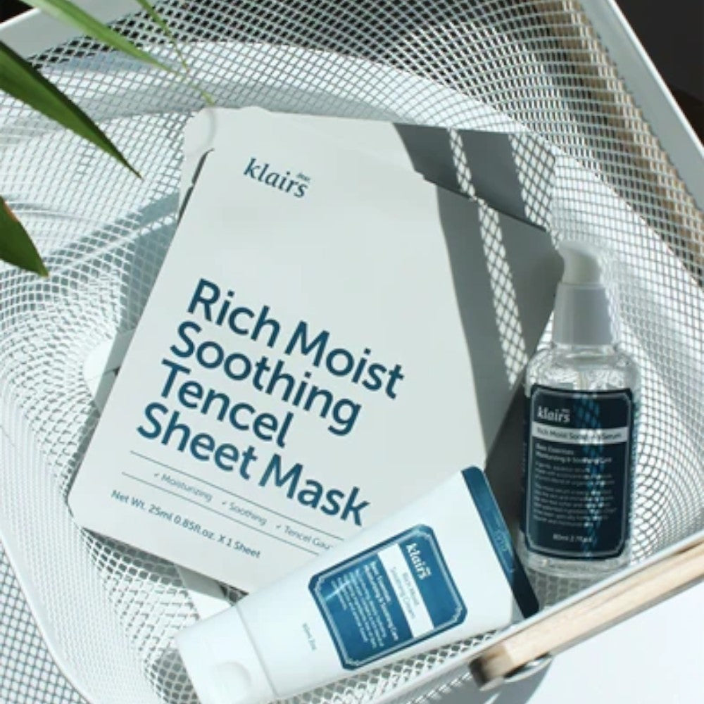 Skin TOGO collection featuring Dear, Klairs Rich Moist Soothing Tencel Sheet Mask, serum, and cream in a white tray.