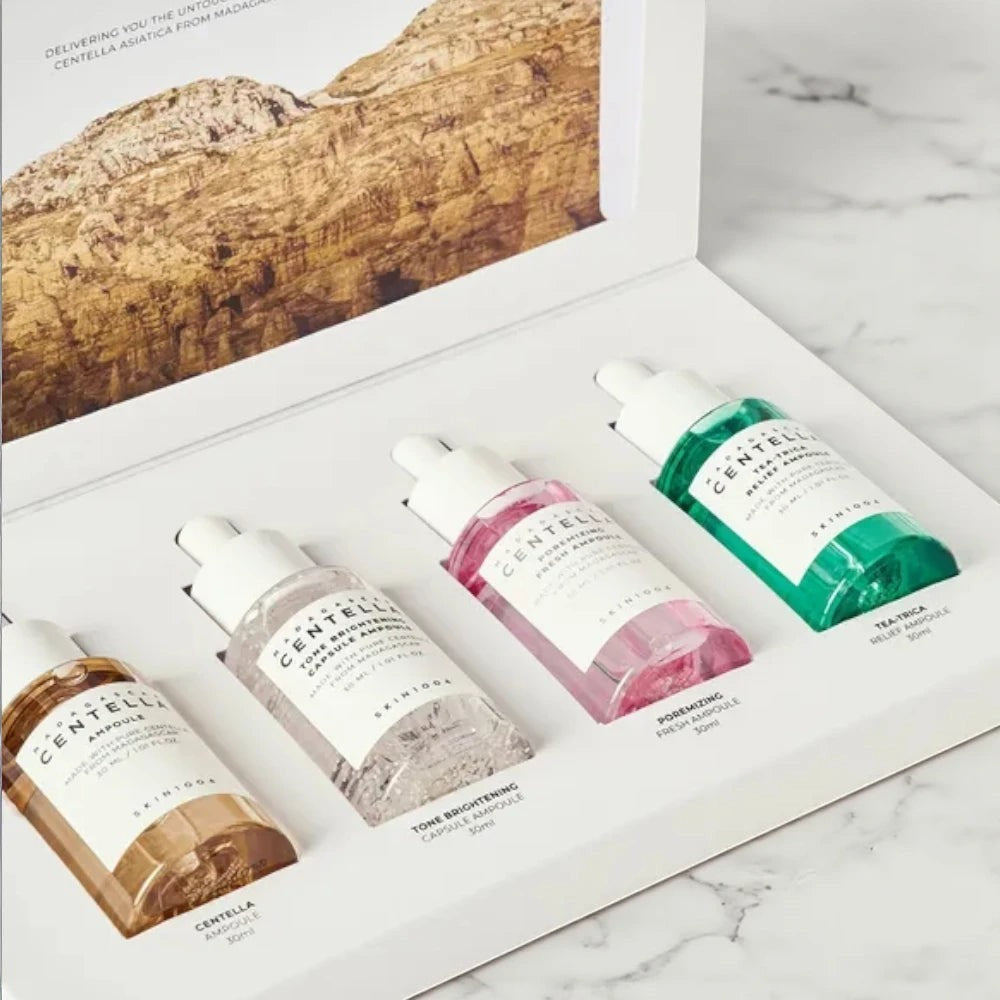 Skin TOGO Madagascar Centella Ampoule Kit featuring four distinct skincare serums in a white presentation box.