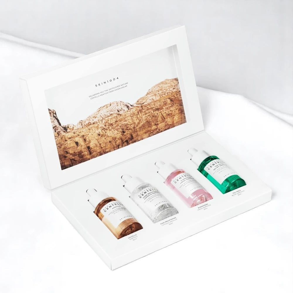 Skin TOGO Madagascar Centella Ampoule Kit featuring four skincare serums in a white presentation box.