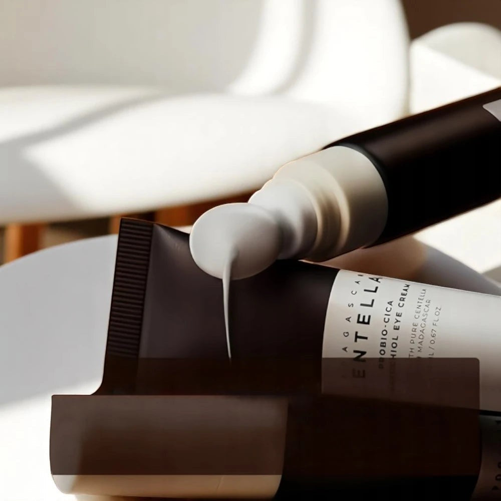 Skin TOGO Madagascar Centella Probio-Cica Bakuchiol Eye Cream tube dispensing rich white cream on a clean surface