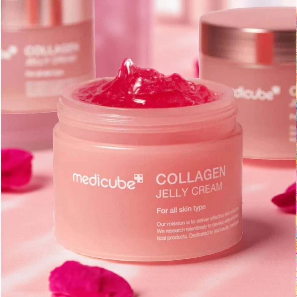 Skin TOGO Medicube Collagen Jelly Cream in a pink jar with a bouncy, translucent gel texture for skin elasticity.