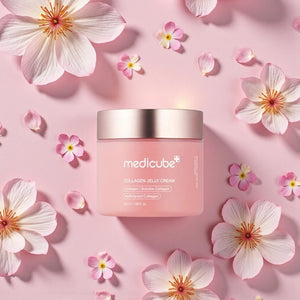 Skin TOGO Medicube Collagen Jelly Cream in a pink jar surrounded by delicate pink flower petals on a soft background.