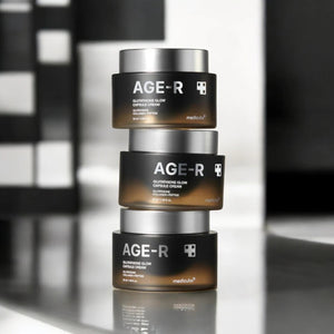 Skin TOGO Medicube AGE-R Glutathione Glow Capsule Cream jars stacked on a reflective surface for brightening skincare.