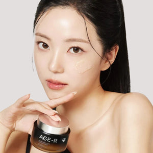 Skin TOGO model applying Medicube AGE-R Glutathione Glow Capsule Cream to her face for a radiant complexion