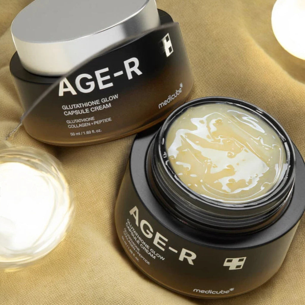 Skin TOGO Medicube AGE-R Glutathione Glow Capsule Cream in black jars with visible brightening gel capsules