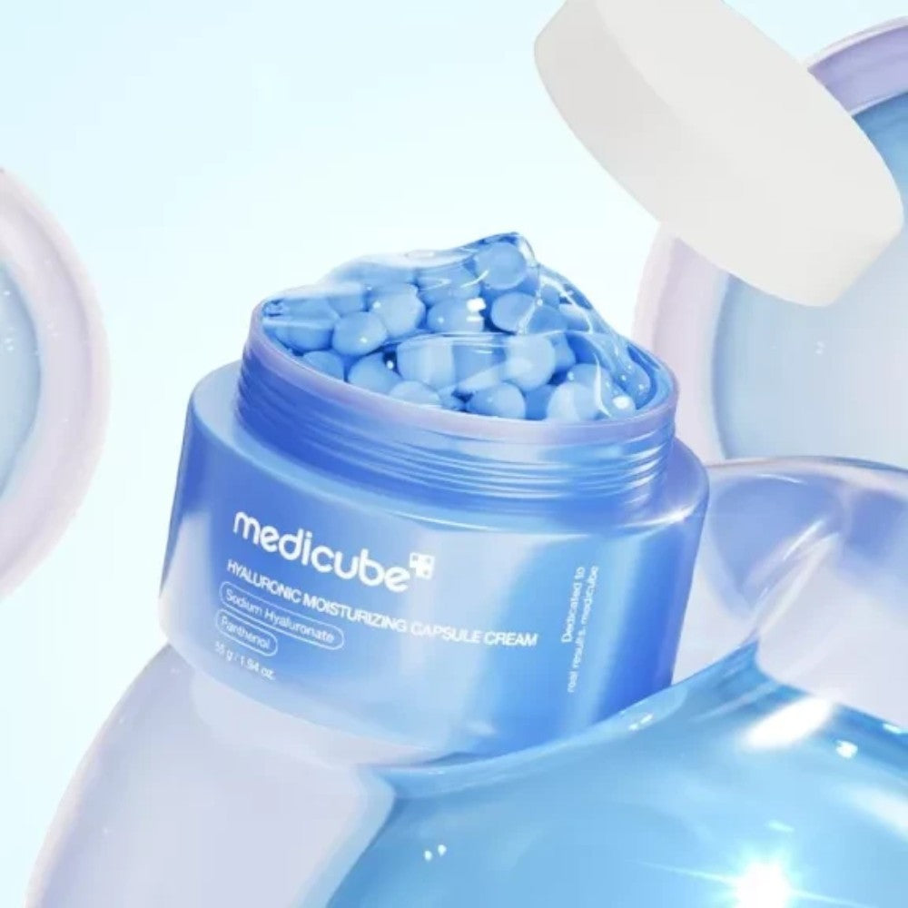 Skin TOGO Medicube Hyaluronic Moisturizing Capsule Cream in a blue jar with visible hydrating micro-capsules.