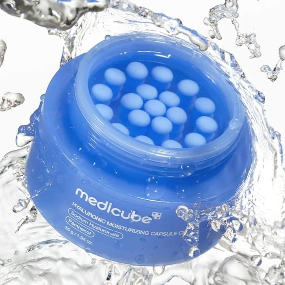 Skin TOGO Medicube Hyaluronic Moisturizing Capsule Cream in a blue jar with visible hydrating capsules and water splash
