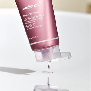 Skin TOGO Medicube PDRN Booster Gel in a metallic pink tube dispensing a clear, lightweight hydrating gel formula.