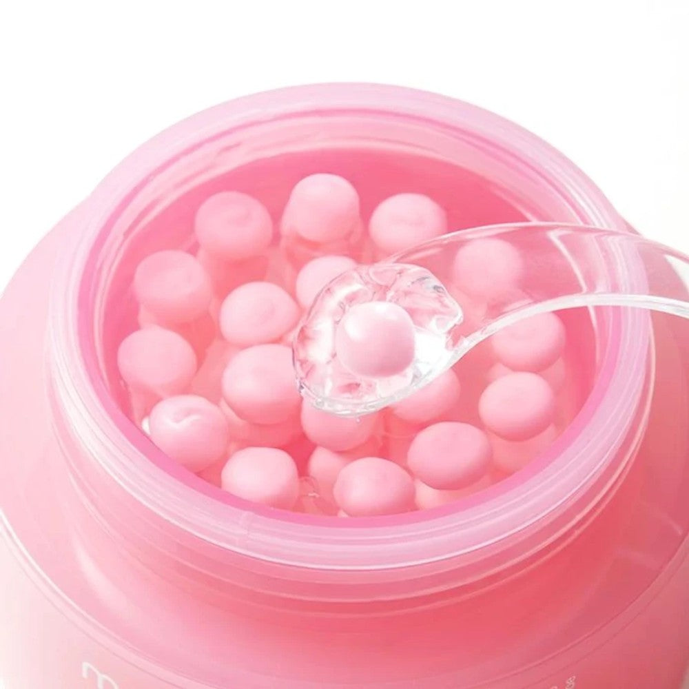 Skin TOGO Medicube PDRN Pink Collagen Capsule Cream with visible pink collagen spheres in a clear hydrating gel base