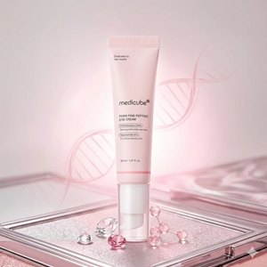 Skin TOGO Medicube PDRN Pink Peptide Eye Cream in a pale pink tube with peptide and DNA graphic elements.