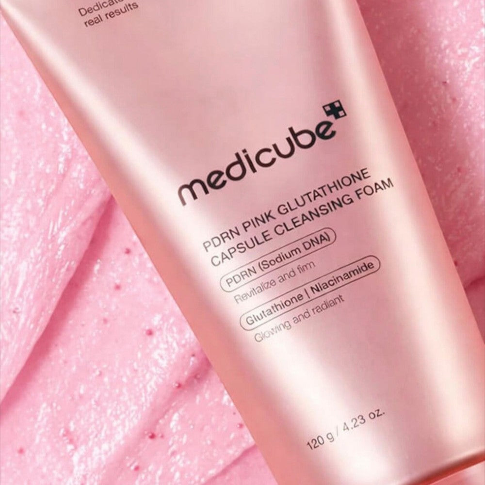 Skin TOGO Medicube PDRN Pink Glutathione Capsule Cleansing Foam in a pink tube with visible exfoliating particles