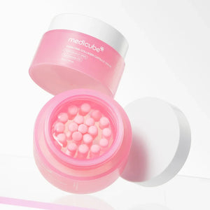 Skin TOGO Medicube PDRN Pink Collagen Capsule Cream in a pink jar with visible collagen capsules inside.