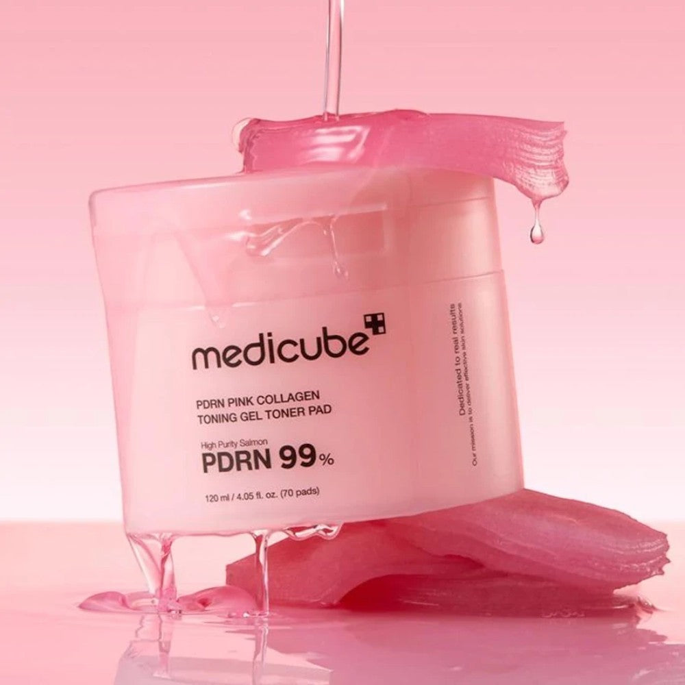 Skin TOGO Medicube PDRN Pink Collagen Toning Gel Toner Pads in a jar with pink essence dripping over the packaging.
