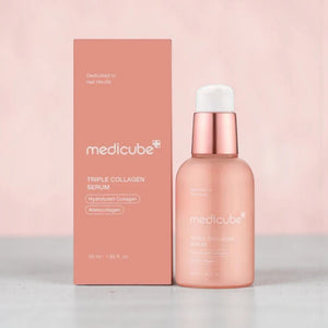 Skin TOGO Medicube Triple Collagen Serum bottle and box in soft pink packaging for anti-aging and skin elasticity.