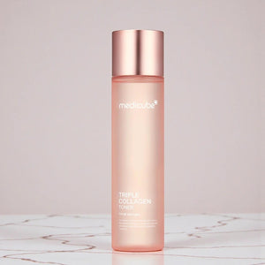 Skin TOGO Medicube Triple Collagen Toner in a pink bottle with a metallic cap for skin elasticity and hydration