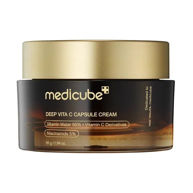 Skin TOGO Medicube Deep Vitamin C Capsule Cream in a dark amber jar with a gold lid for brightening skin.