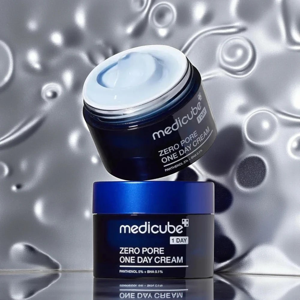 Skin TOGO Medicube Zero Pore One-day Cream in a dark blue jar with a light blue gel-cream texture on a metallic background