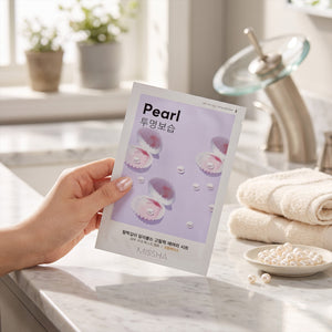 Skin TOGO Missha Airy Fit Pearl sheet mask held in hand, featuring pearl illustrations on a light purple background.