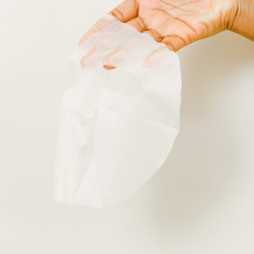 Skin TOGO Missha Airy Fit Pearl sheet mask made of ultra-thin rice paper held in a hand against a neutral background