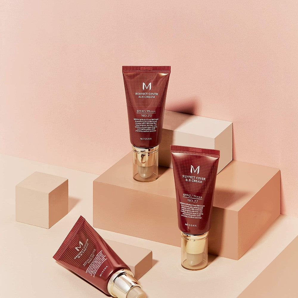 Skin TOGO Missha M Perfect Cover BB Cream tubes in various shades displayed on minimalist geometric podiums
