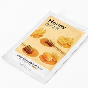 Skin TOGO Missha Airy Fit Honey sheet mask packaging with honey dipper and honeycomb illustrations on a white background