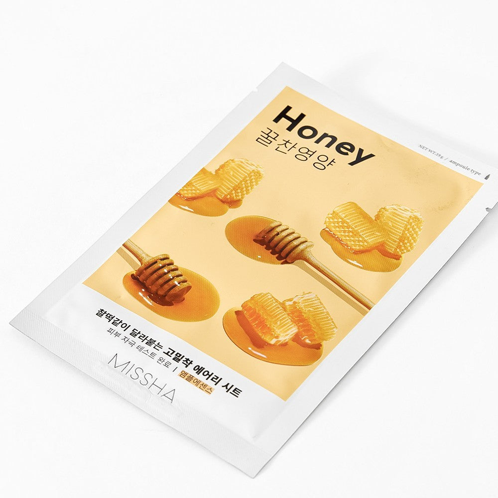 Skin TOGO Missha Airy Fit Honey sheet mask packaging with honey dipper and honeycomb illustrations on a white background