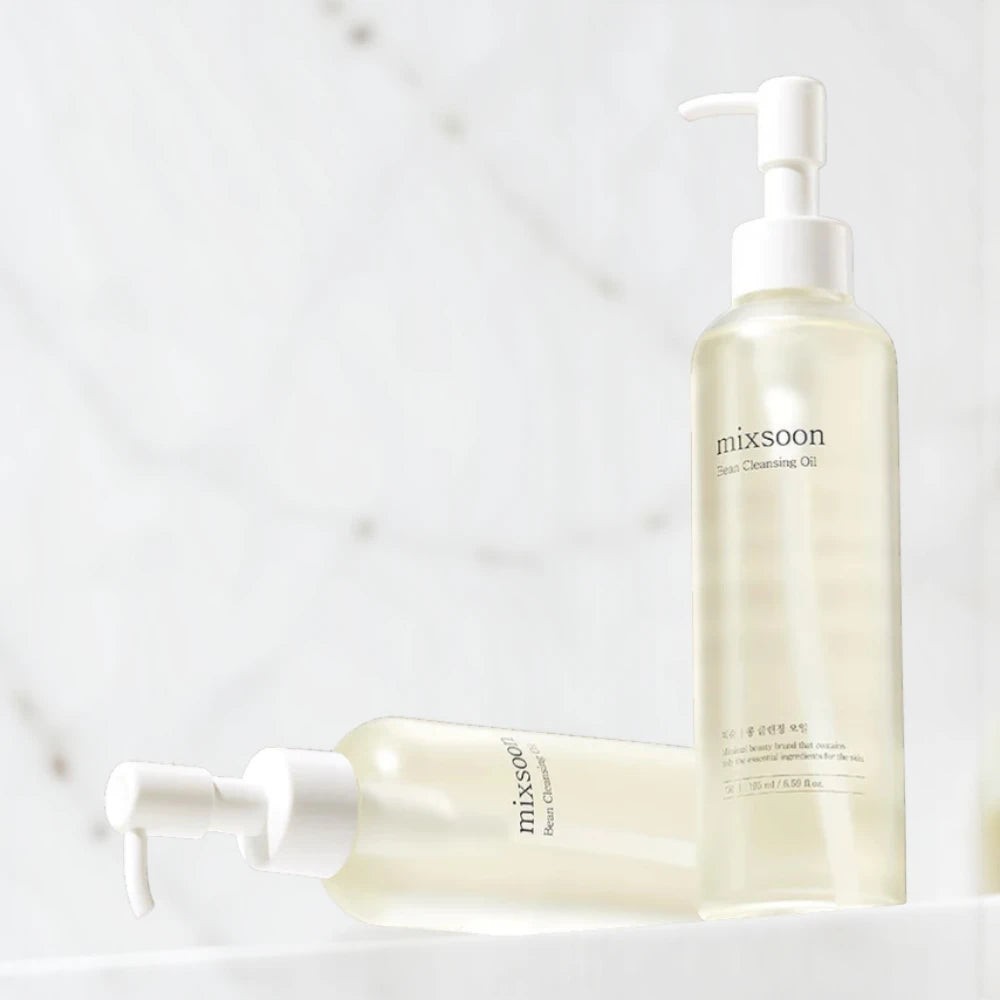 Skin TOGO Mixsoon Bean Cleansing Oil bottles with pump dispensers for deep facial makeup removal and nourishment.