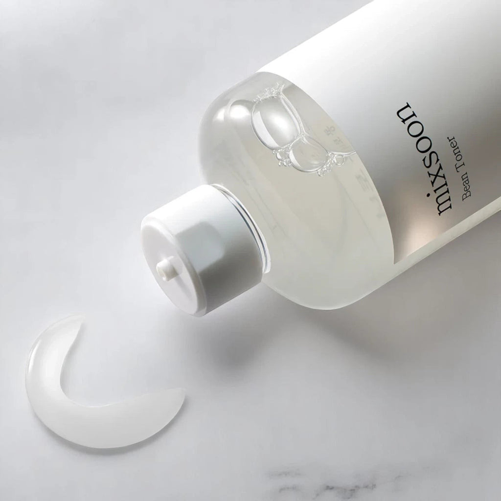 Skin TOGO Mixsoon Bifida Toner in a clear bottle with a white cap, showing a drop of the lightweight liquid texture.