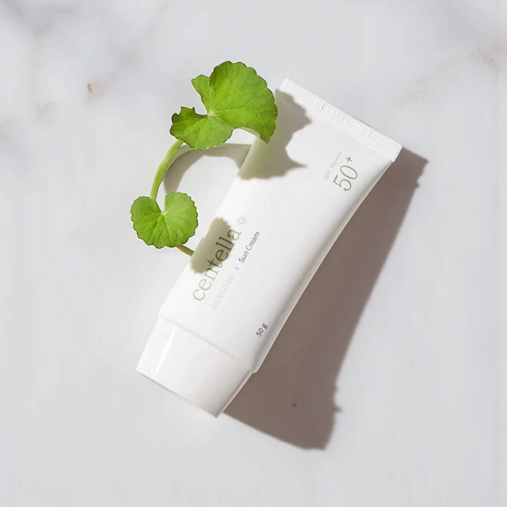 Skin TOGO Mixsoon Centella Sun Cream SPF 50+ in a white tube decorated with a fresh green centella leaf.