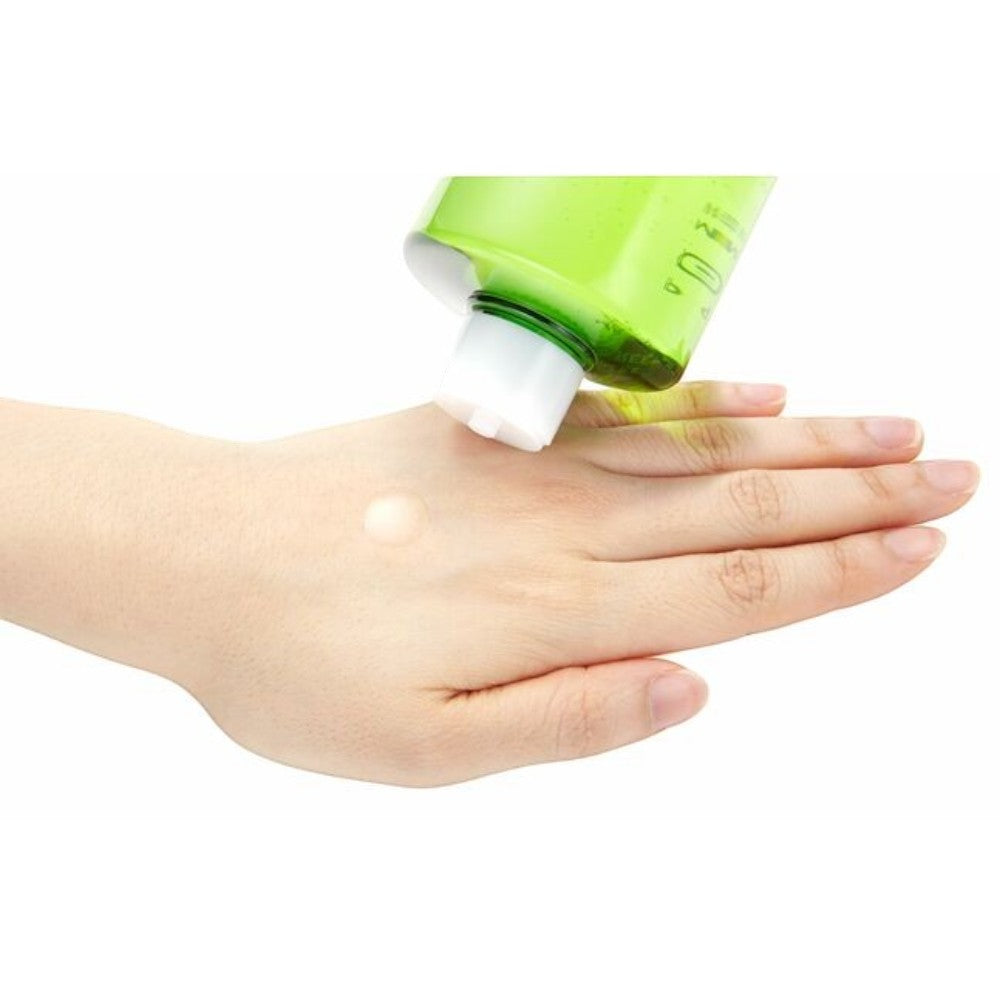 Skin TOGO NATURE REPUBLIC Young Green Tea Mild Toner being applied to a hand, showing its clear, watery texture.