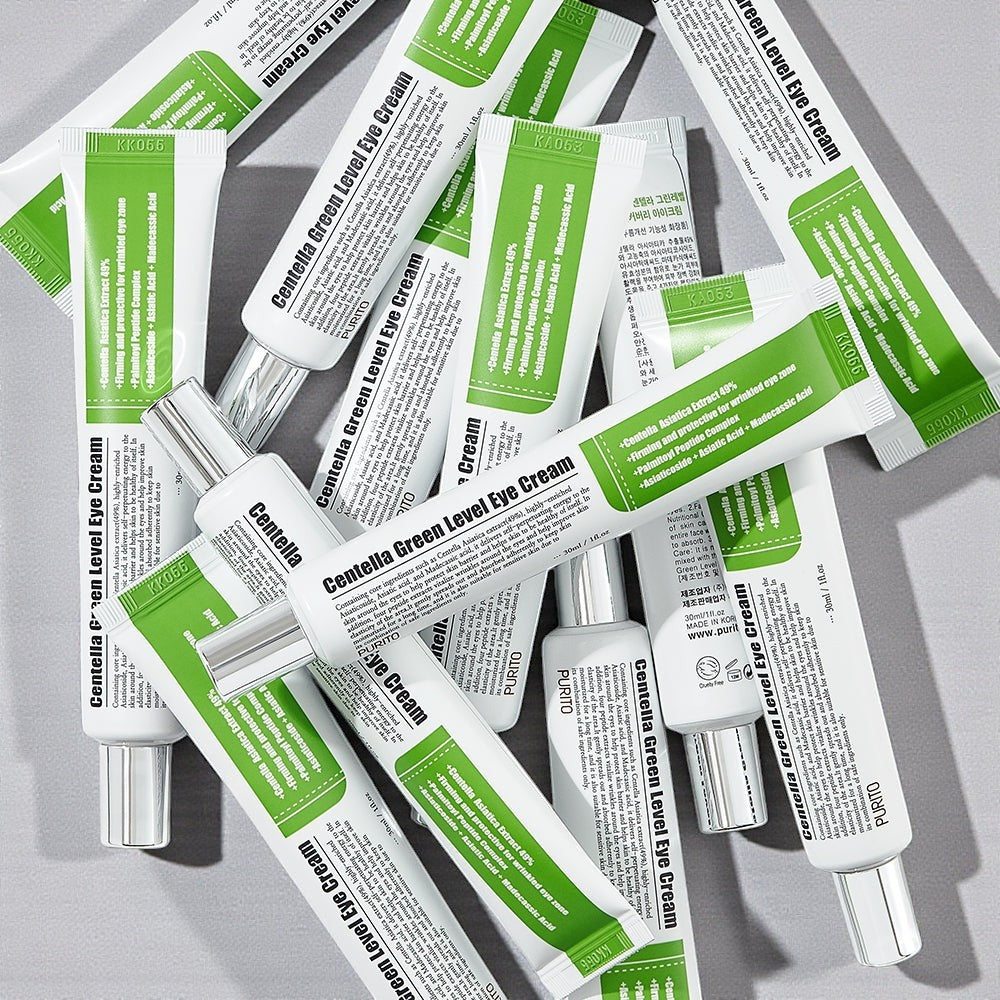 Skin TOGO Purito Centella Green Level eye cream tubes arranged in a flat lay pattern on a light grey background.