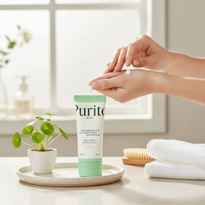 Skin TOGO Purito Wonder Releaf Centella Daily Sun Cream tube with hands applying white lotion, set on a bright table.