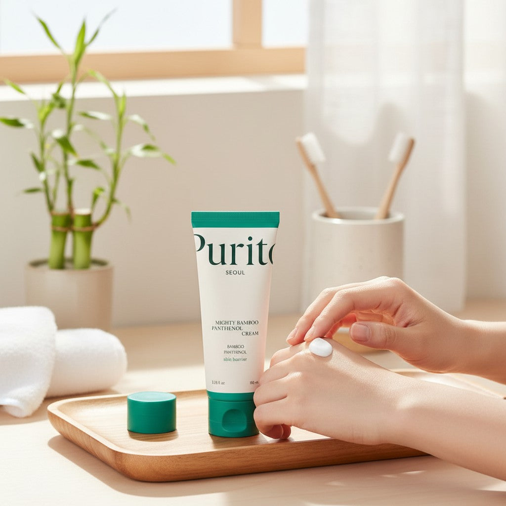 Skin TOGO Purito Mighty Bamboo Panthenol Cream tube on a wooden tray with a person applying cream to their hand.