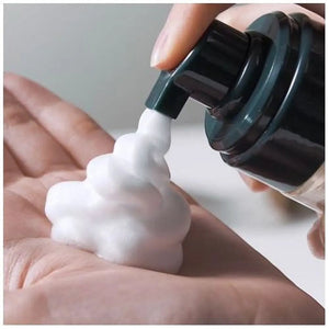 Skin TOGO Pyunkang Yul ACNE facial cleanser dispensing thick white foam into a hand for gentle acne treatment