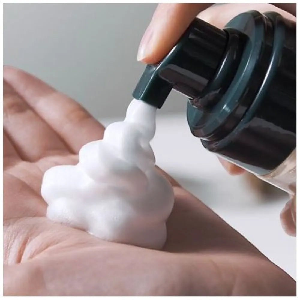 Skin TOGO Pyunkang Yul ACNE facial cleanser dispensing thick white foam into a hand for gentle acne treatment