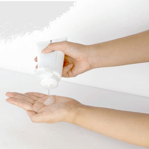 Skin TOGO Pyunkang Yul ACNE Facial Cleanser being squeezed into a hand, showing the clear gel texture.