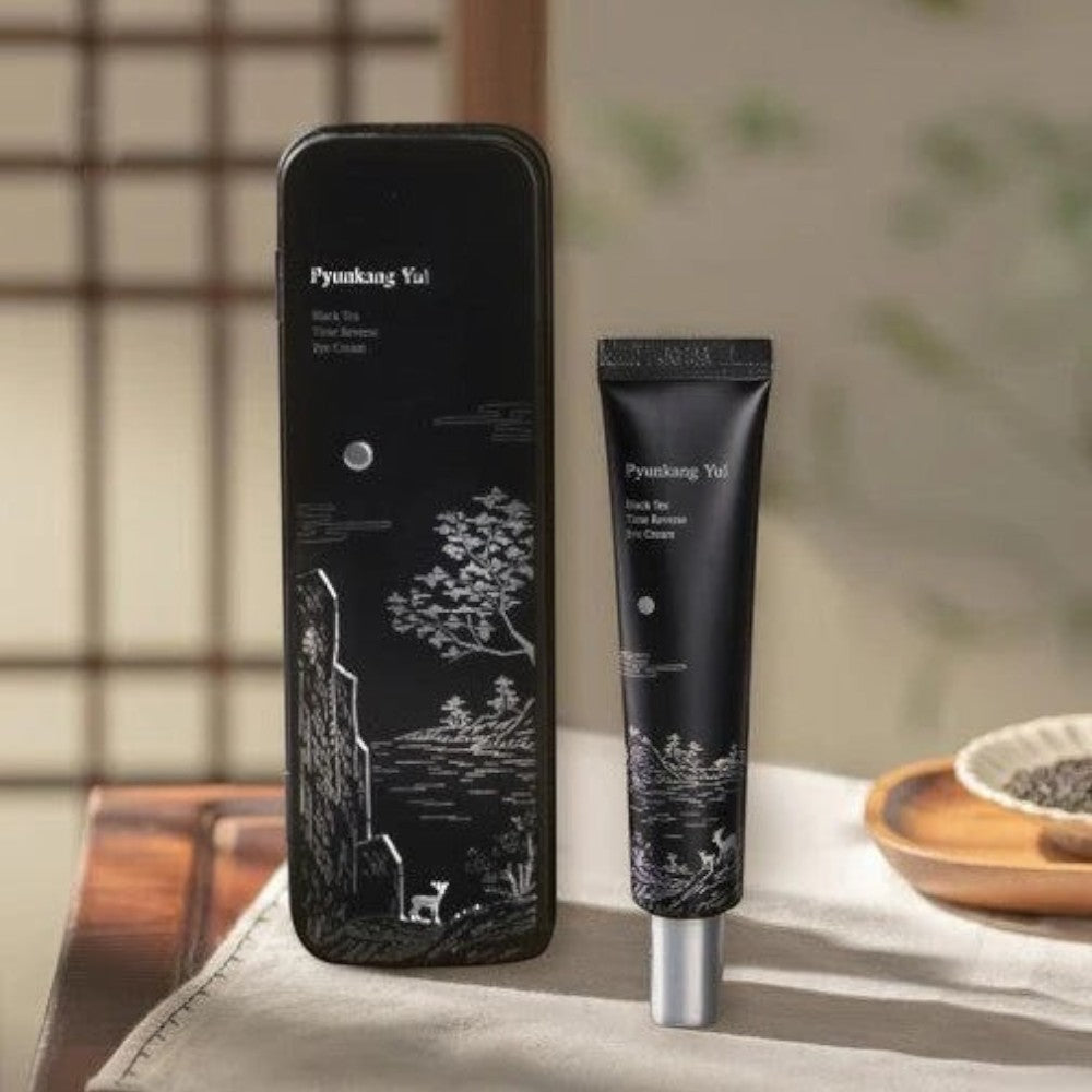 Skin TOGO Pyunkang Yul Black Tea Time Reverse Eye Cream tube and its decorative black box on a neutral background.