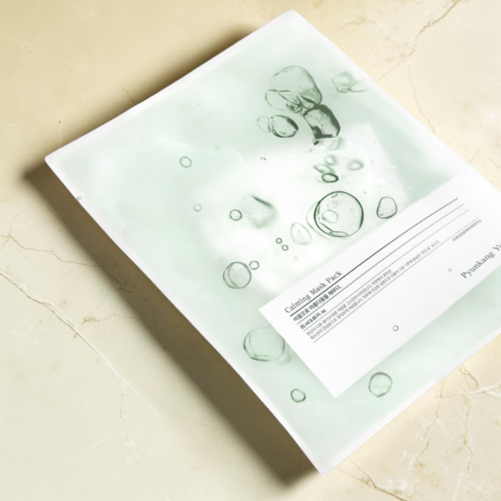 Skin TOGO Pyunkang Yul Calming Mask Sheet in a minimalist white and light green packaging with bubble graphic design.