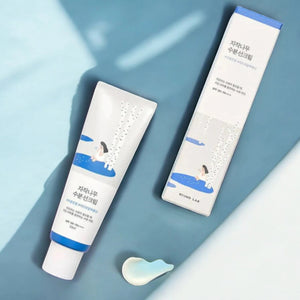 Skin TOGO Round Lab Birch Juice Moisturizing Sun Cream tube and box with blue and white birch tree design
