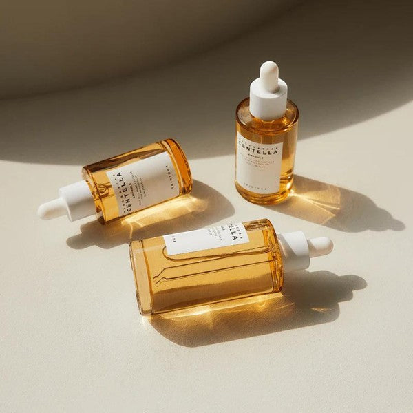Skin TOGO SKIN1004 Madagascar Centella Ampoule bottles with amber glass and white droppers on a neutral surface
