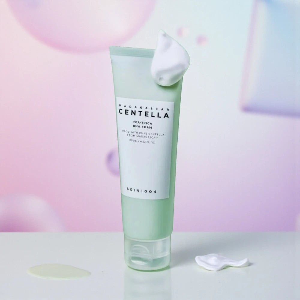 Skin TOGO SKIN1004 Madagascar Centella Tea-Trica BHA foam cleanser in a light green tube with creamy white foam.