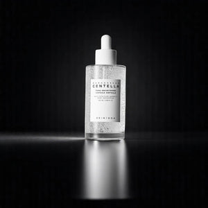 Skin TOGO SKIN1004 Centella Tone Brightening Capsule Ampoule in a clear glass dropper bottle on a dark background.