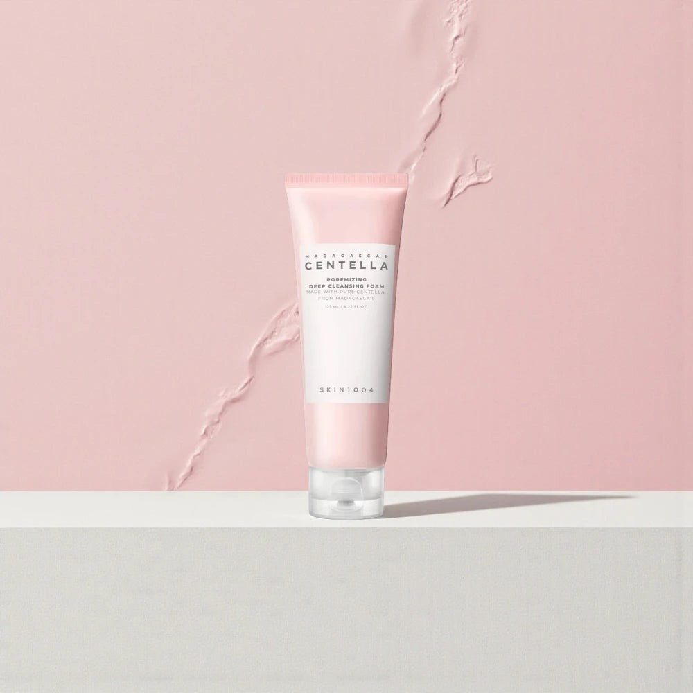 Skin TOGO SKIN1004 Madagascar Centella Poremizing Deep Cleansing Foam in a pink tube on a minimalist background.