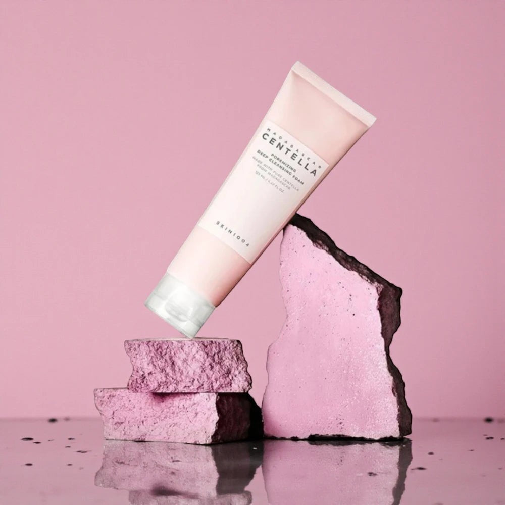 Skin TOGO SKIN1004 Madagascar Centella Poremizing Deep Cleansing Foam tube balanced on pink decorative stones.
