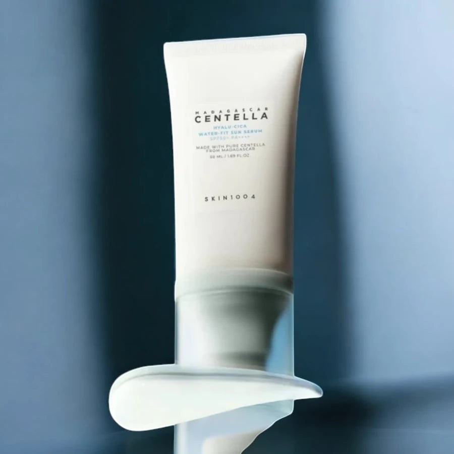 Skin TOGO SKIN1004 Madagascar Centella Hyalu-Cica Water-Fit Sun Serum tube with a creamy texture swatch