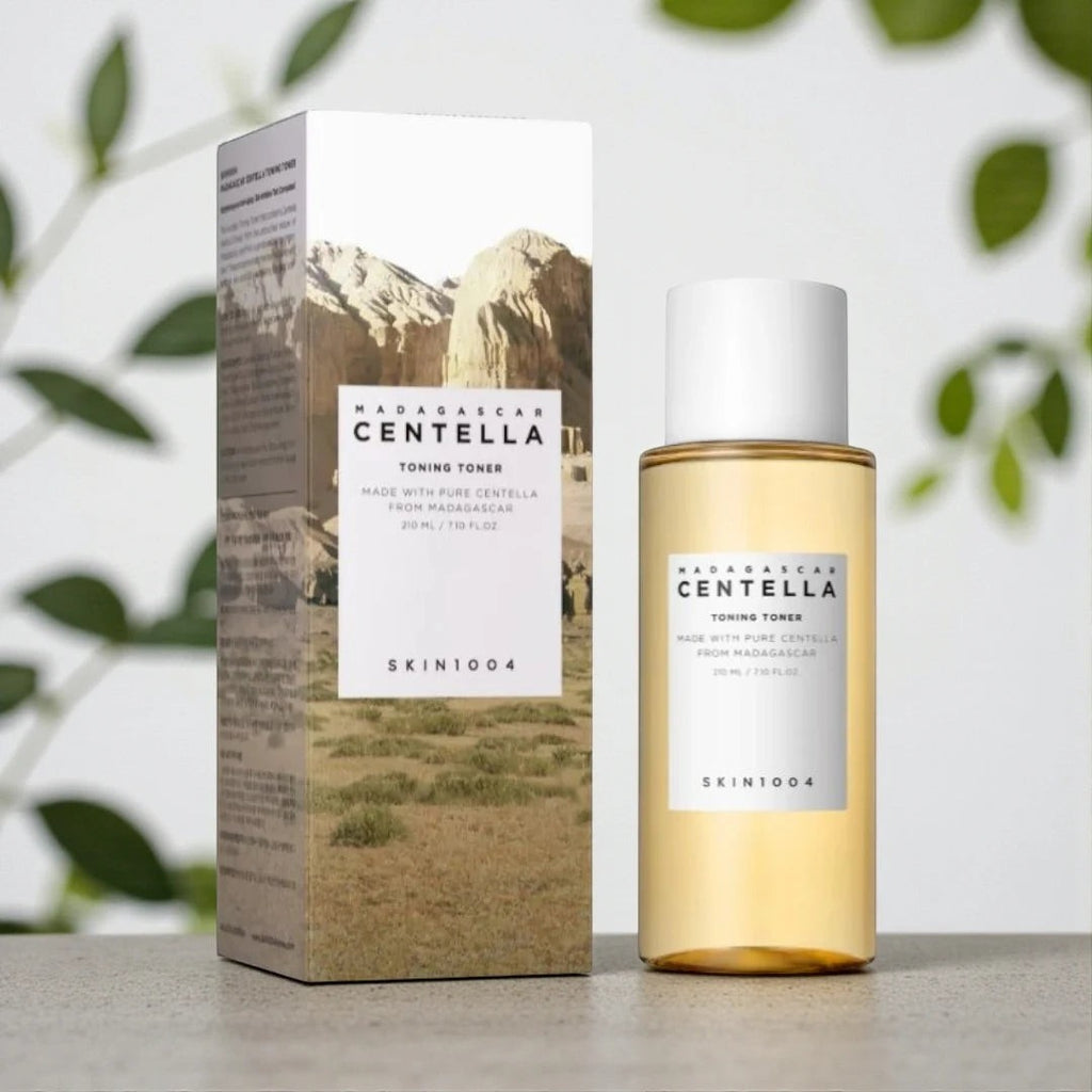 Skin TOGO SKIN1004 Madagascar Centella Toning Toner bottle and box with landscape imagery on a neutral surface.